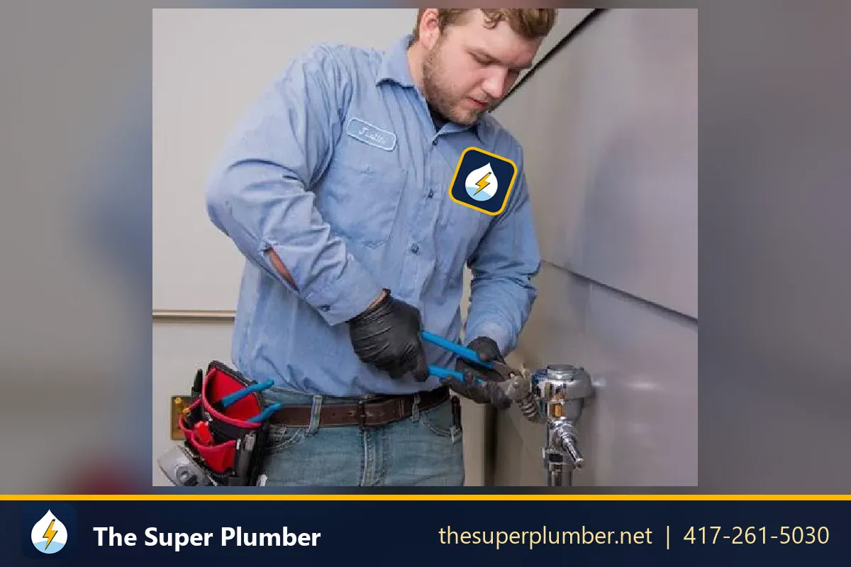 Technician using a wrench on a flush valve in a commercial restroom - toilet installation